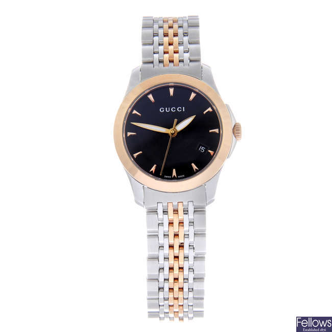 GUCCI - a lady's bi-colour G-Timeless bracelet watch.