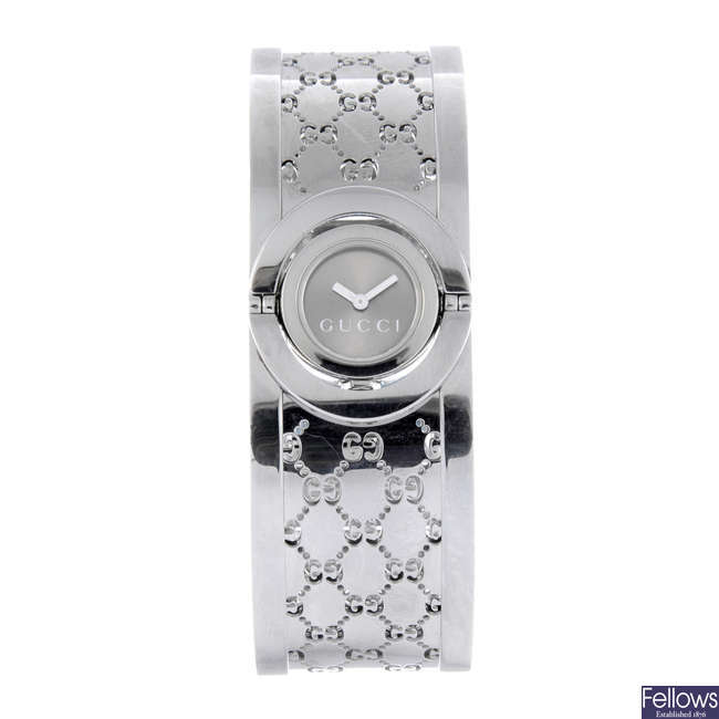 GUCCI - a lady's stainless steel Twirl bangle watch.
