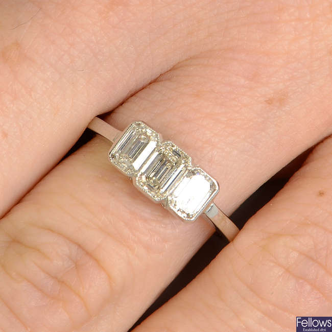 A rectangular-shape diamond three-stone ring.