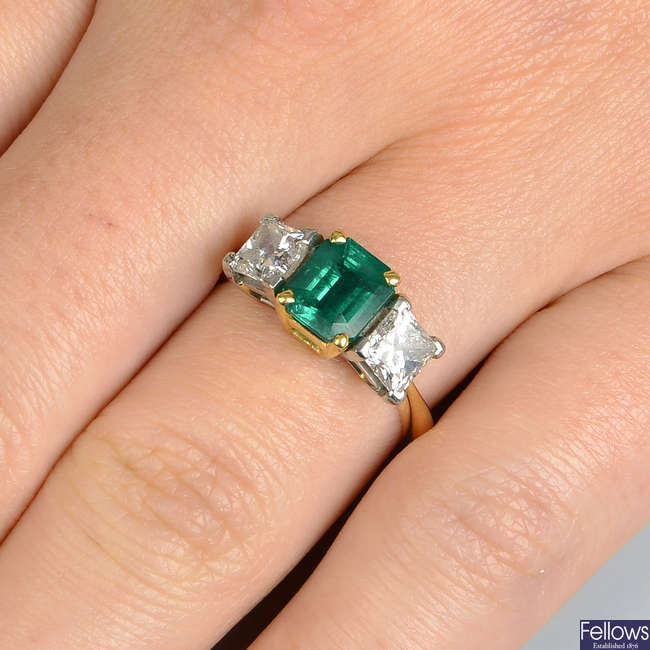 A Colombian emerald and diamond three-stone ring.