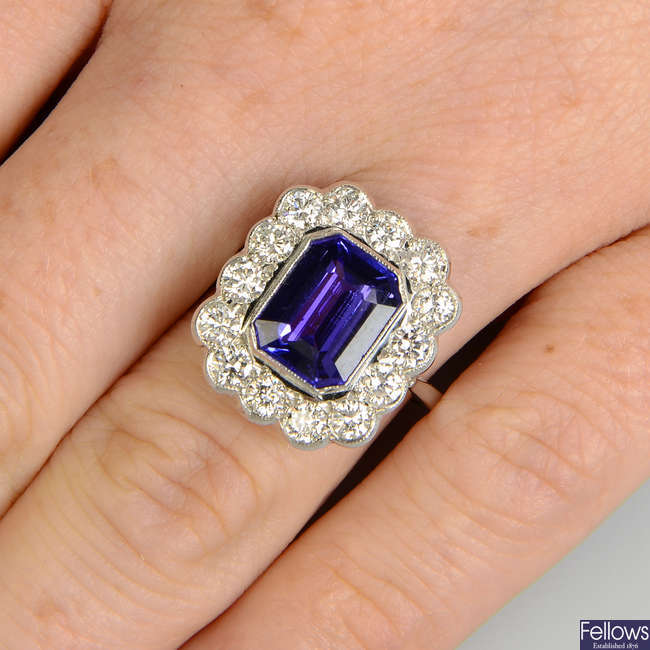 A rectangular-shape tanzanite and brilliant-cut diamond scalloped cluster ring.