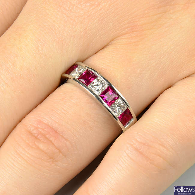 An 18ct gold square-shape ruby and diamond half eternity ring.
