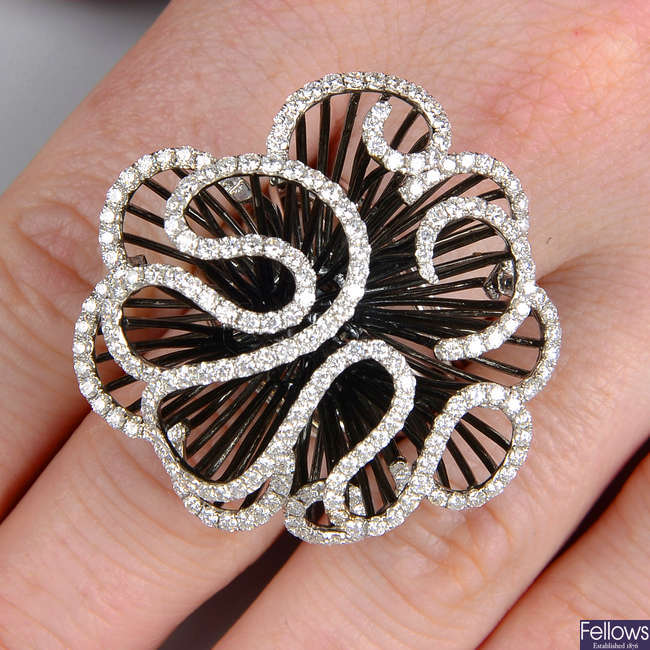 A diamond abstract floral dress ring.