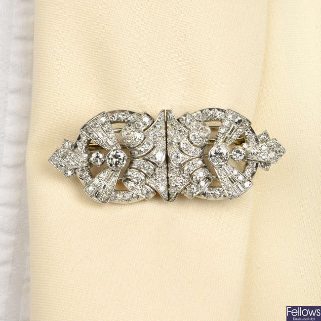 A mid 20th century platinum diamond double clip brooch.