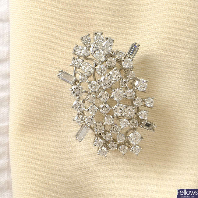 A marquise-shape, brilliant and baguette-cut diamond cluster brooch/pearl enhancer.