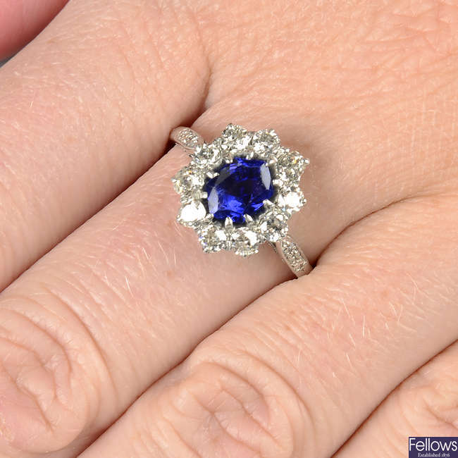 A Burmese sapphire and old-cut diamond cluster ring, with single-cut diamond shoulders.
