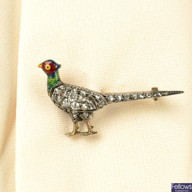 A late Victorian, silver and gold, pave-set diamond and enamel pheasant brooch.