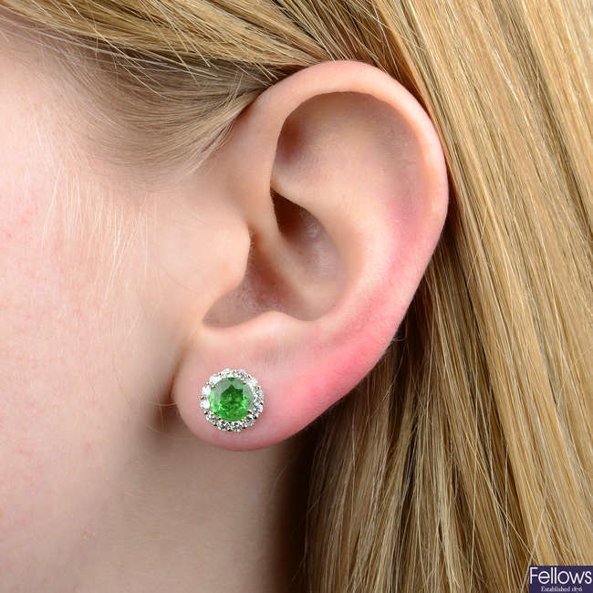 A pair of green garnet and brilliant-cut diamond cluster earrings.