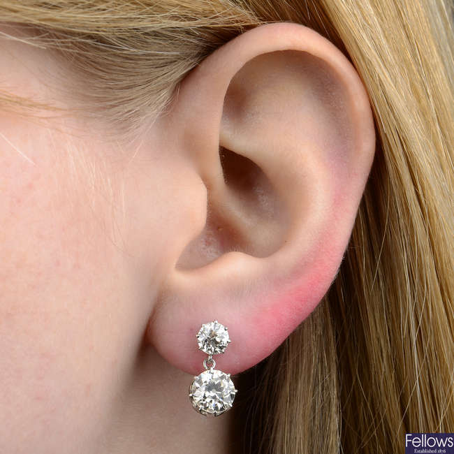 A pair of early 20th century platinum old-cut diamond drop earrings.