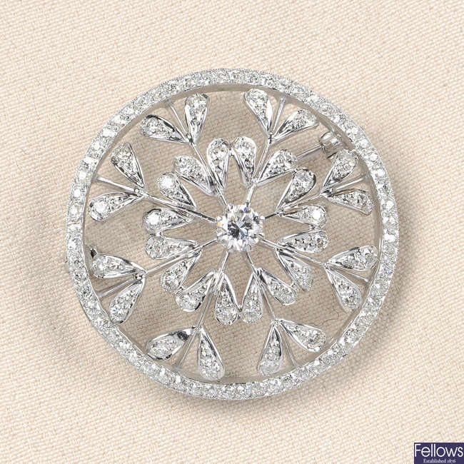 A diamond openwork floral brooch.