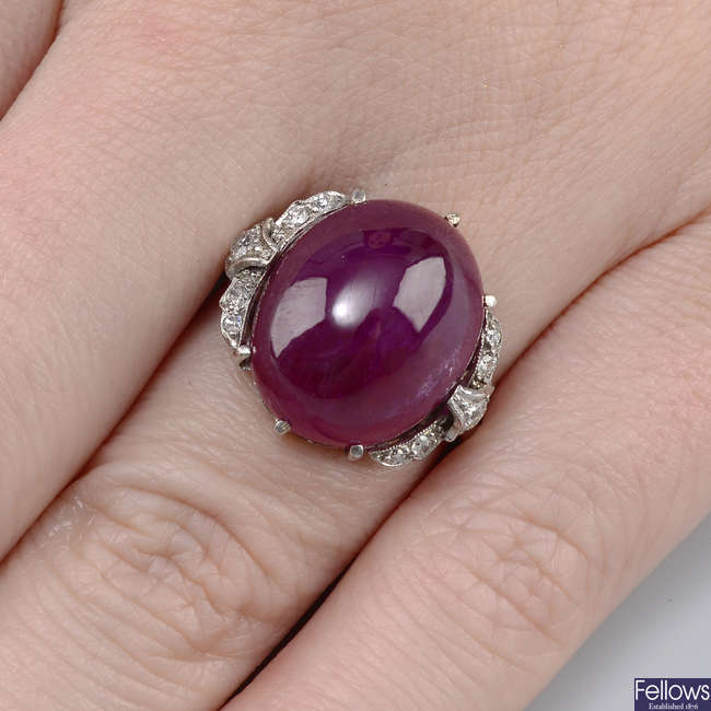 A mid 20th century platinum ruby cabochon and diamond dress ring.