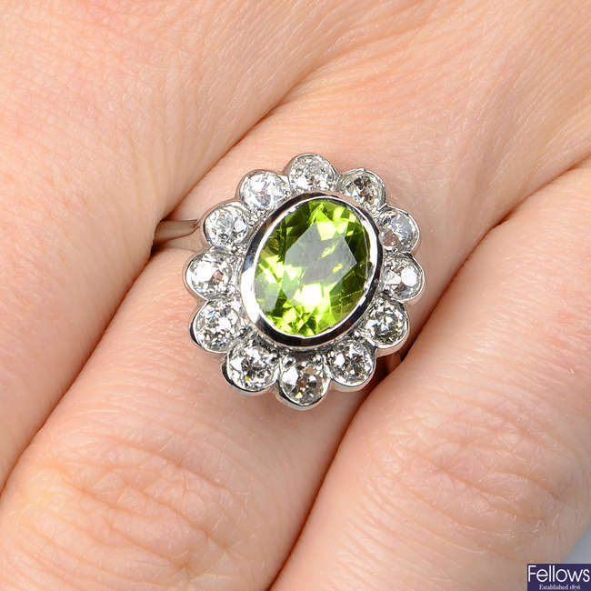 A peridot and old-cut diamond floral cluster ring.