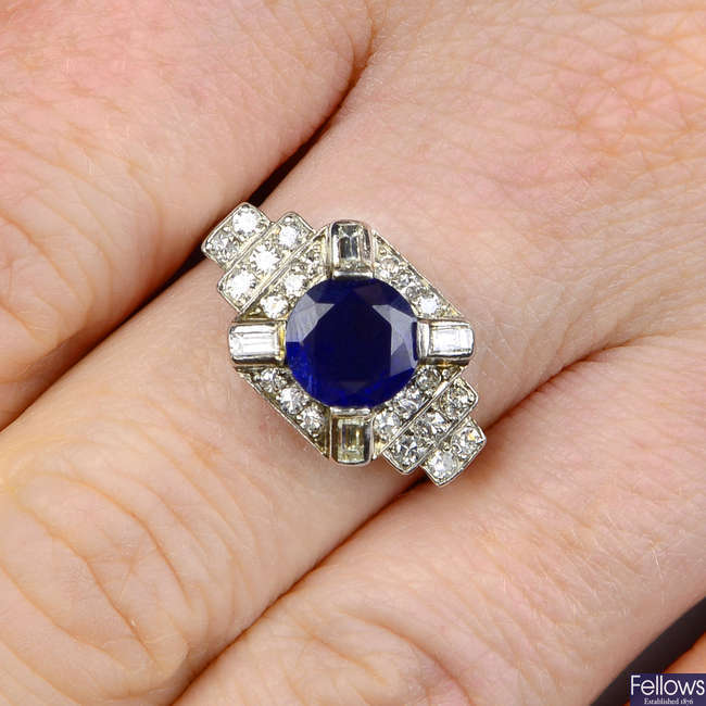 An Art Deco platinum sapphire and vari-cut diamond dress ring.