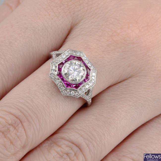 A brilliant-cut diamond and ruby dress ring.