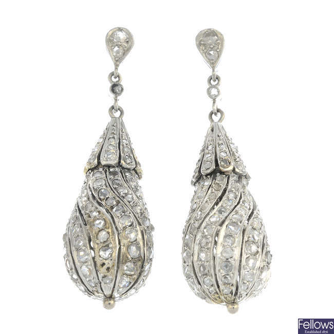 A pair of rose-cut diamond earrings.