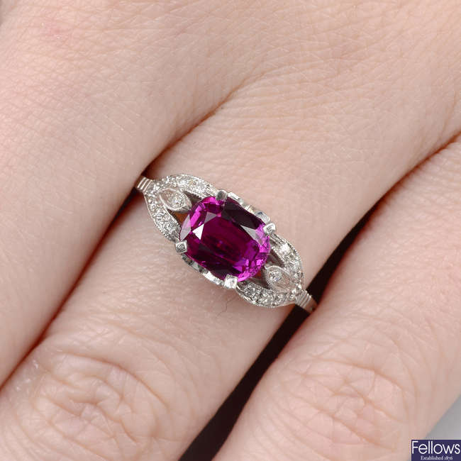 A Burmese ruby dress ring, with brilliant-cut diamond floral shoulders and gallery.