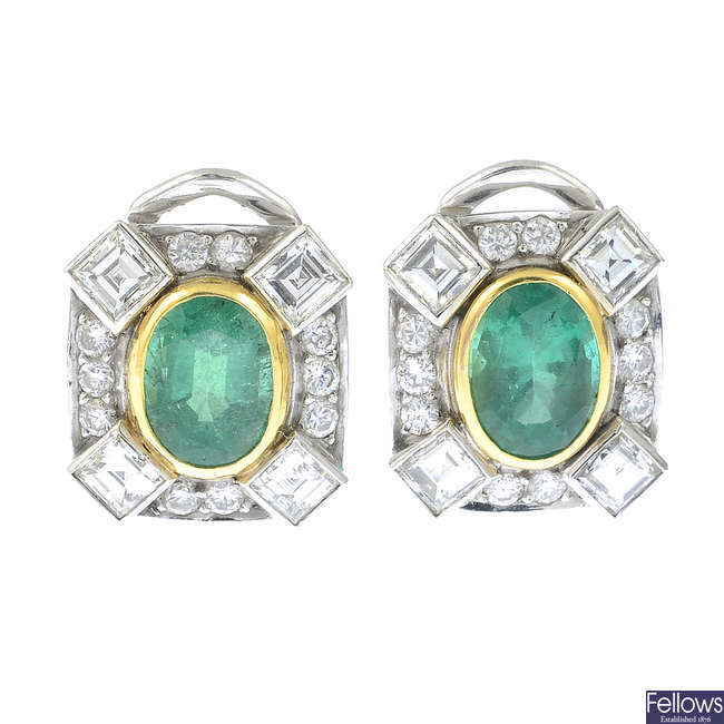 A pair of oval-shape emerald and vari-cut diamond earrings.
