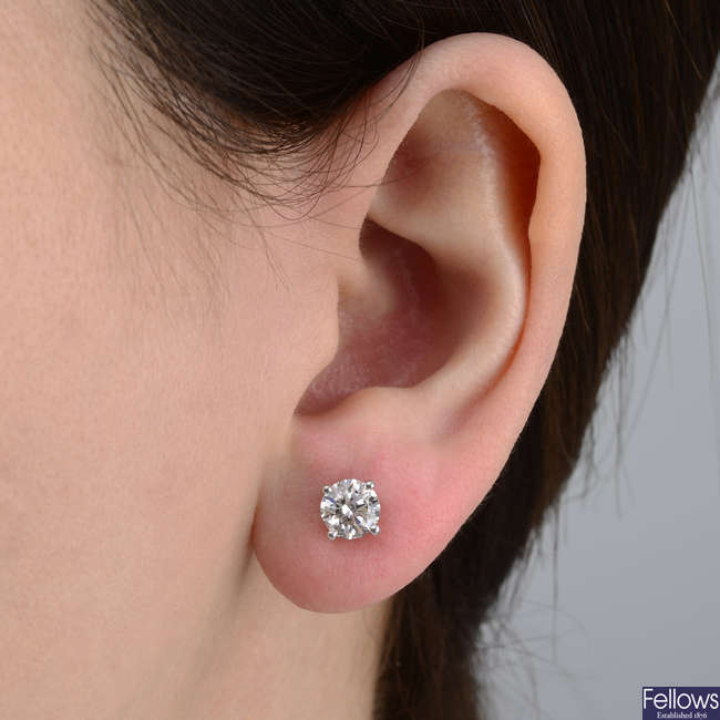 A pair of brilliant-cut diamond stud earrings, by Tiffany & Co.