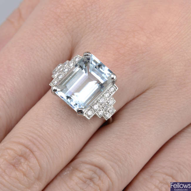 An aquamarine and diamond dress ring.