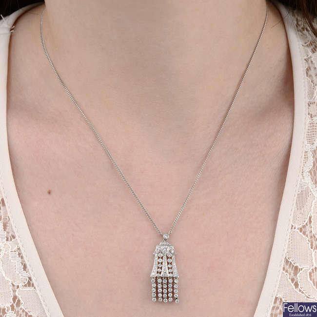 An 18ct gold brilliant-cut diamond tassel pendant, with integral chain.