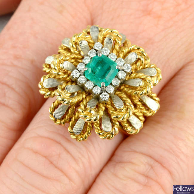 A mid 20th century emerald and diamond bi-colour floral cluster ring.