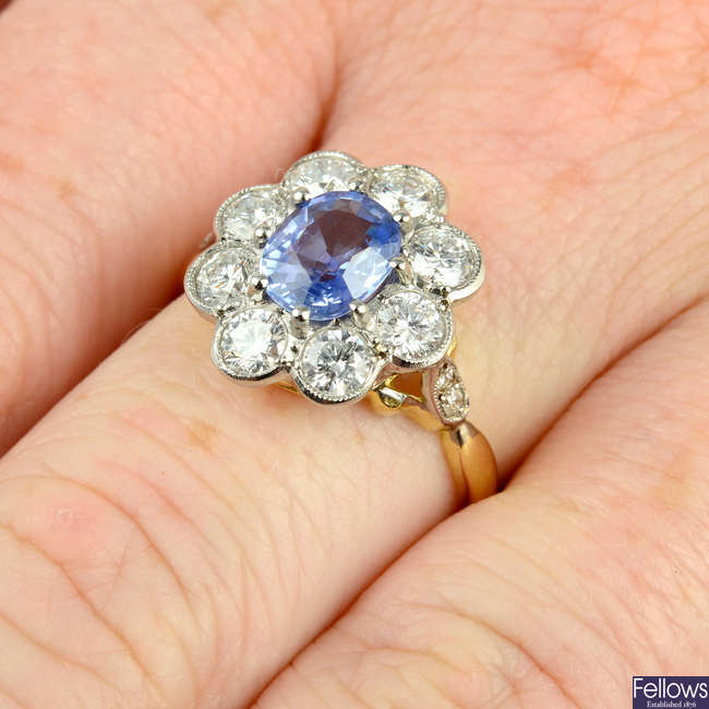 A sapphire and brilliant-cut diamond floral cluster ring.