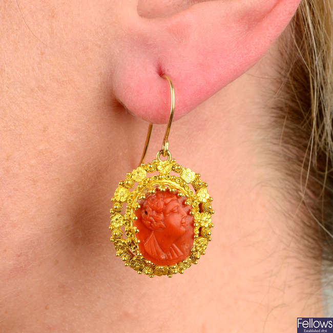 A pair of mid to late 19th century gold coral cameo earrings.