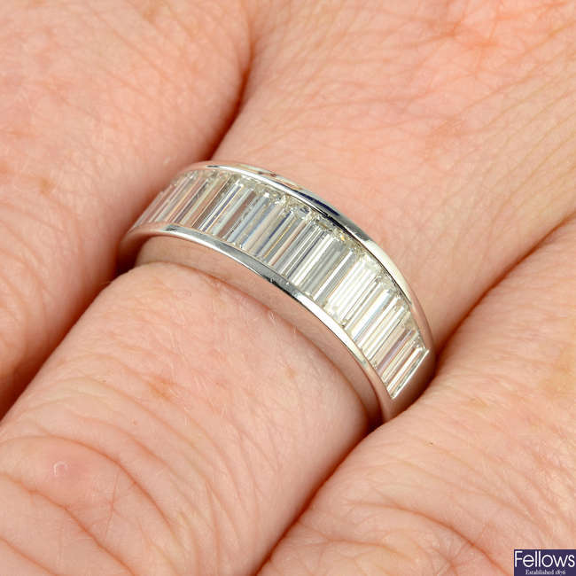 A graduated baguette-cut diamond half eternity ring.