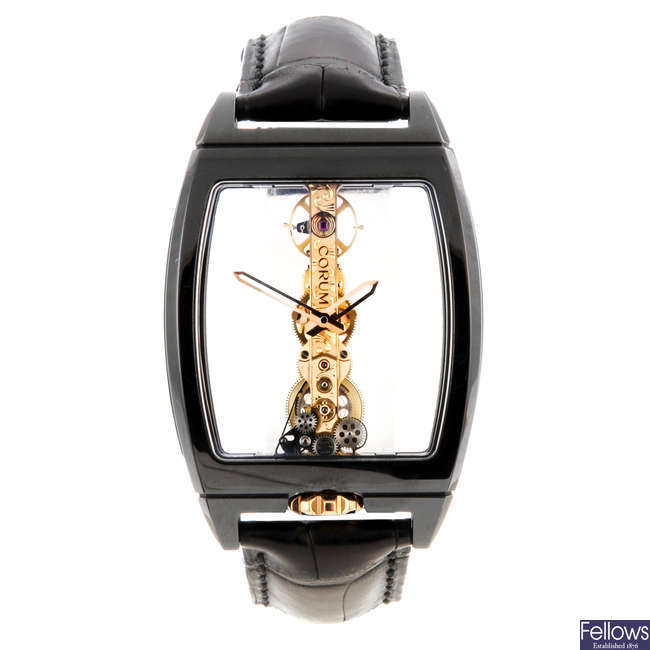 CORUM - a gentleman's black ceramic Golden Bridge wrist watch.