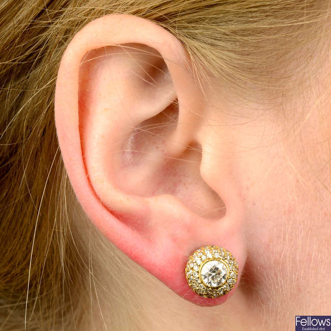 A pair of brilliant-cut diamond stud earrings, with pav