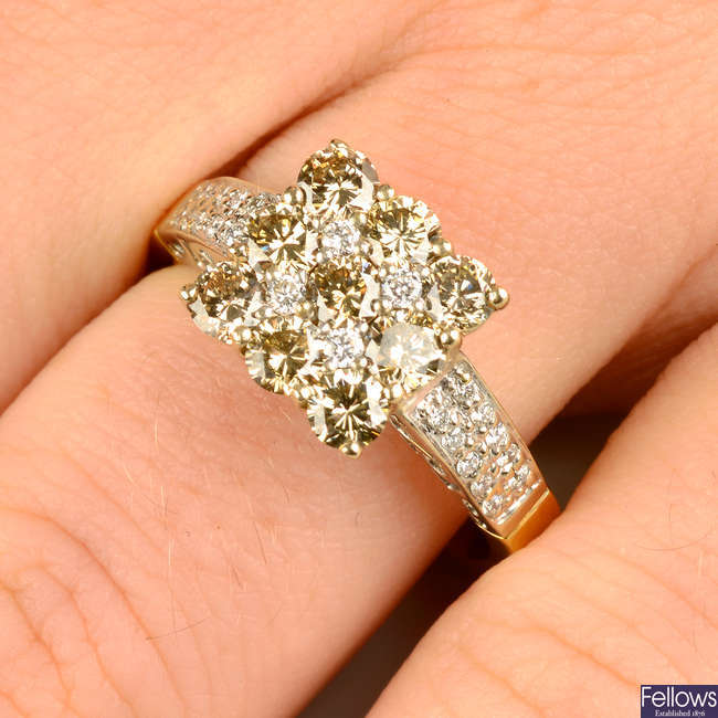 A 'brown' diamond and diamond cluster ring, with pavé-set diamond shoulders.