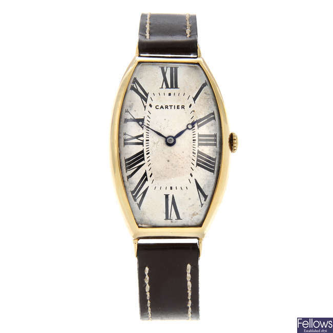 CARTIER - a rare and early Tonneau Curvex wrist watch. Circa 1914.
