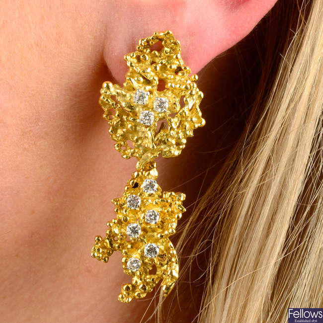 A pair of 1970's textured openwork and scattered brilliant-cut diamond earrings, with detachable drop, by George Weil.