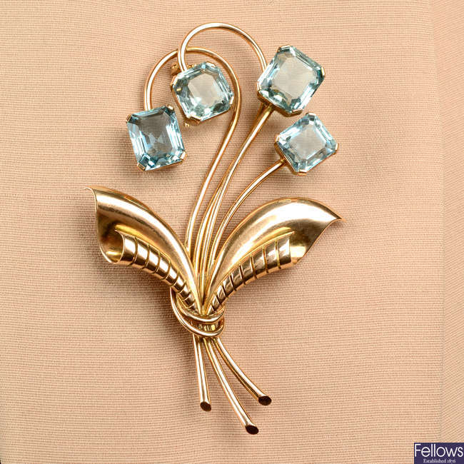 A 1940s 14ct gold aquamarine floral brooch.