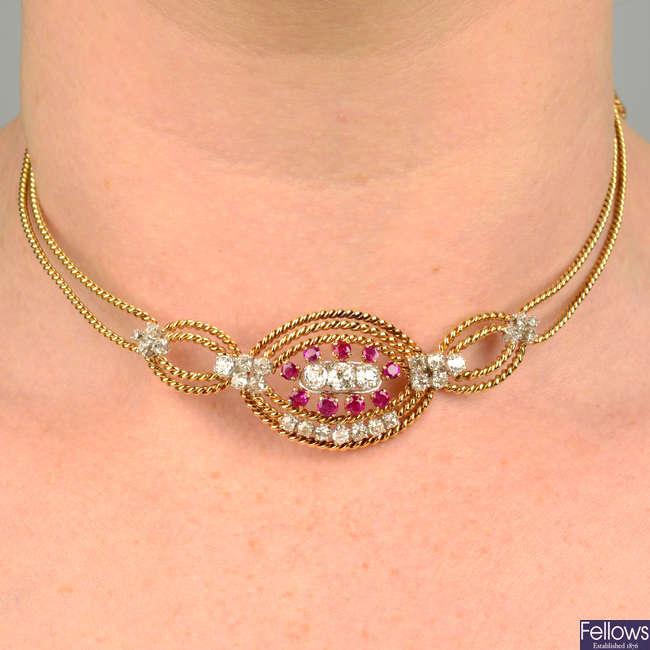 An old-cut diamond and ruby rope-twist necklace, with flat curb-link back-chain.