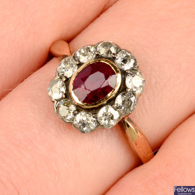 A Burmese ruby and circular-cut diamond cluster ring.