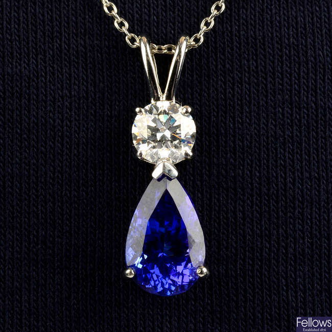 A platinum tanzanite and brilliant-cut diamond pendant, with chain.