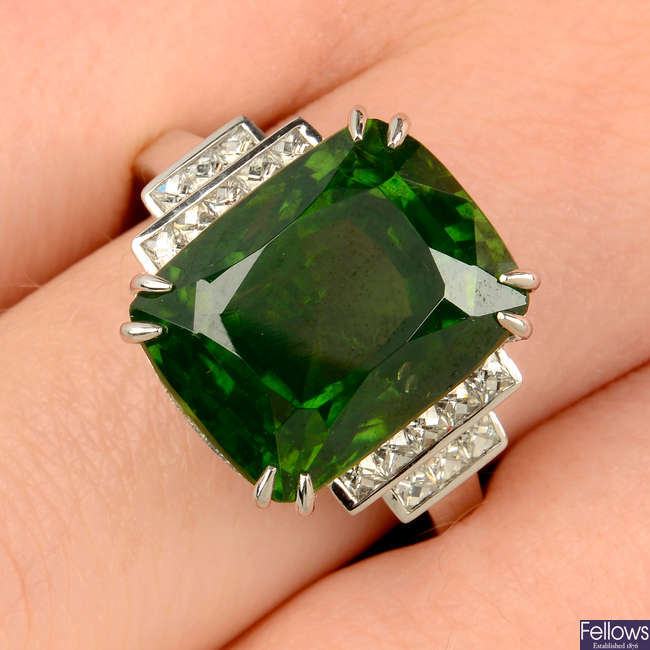 An 18ct gold green zircon and French-cut diamond ring.