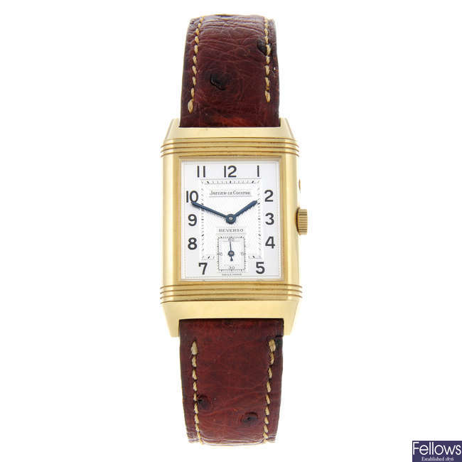 JAEGER-LECOULTRE - a gentleman's 18ct yellow gold Reverso Night & Day wrist watch.