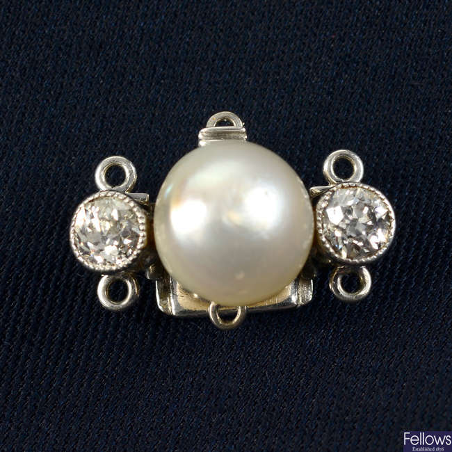 A natural pearl and old-cut diamond clasp.