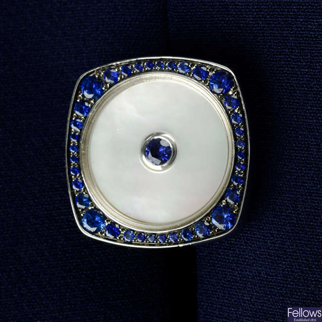 A pair of 18ct gold sapphire and mother-of-pearl cufflinks.