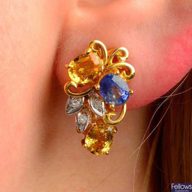 A pair of sapphire, yellow sapphire and diamond floral earrings.