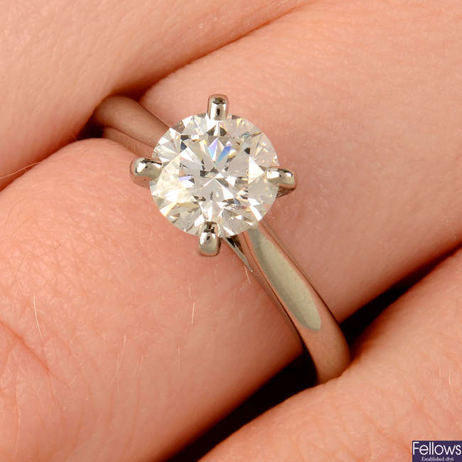 A brilliant-cut diamond single-stone ring, by Cartier.