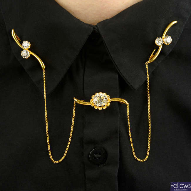 A cushion-shape and circular-cut diamond triple brooch collar attachment.