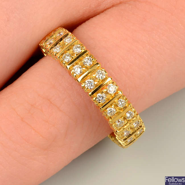 A brilliant-cut diamond full eternity ring, with similarly-cut diamond sides, by Boucheron.