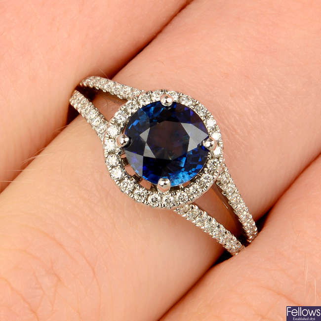 A sapphire and diamond cluster dress ring.