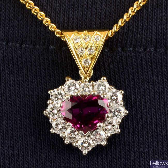 An 18ct gold ruby and diamond cluster heart pendant, with chain.