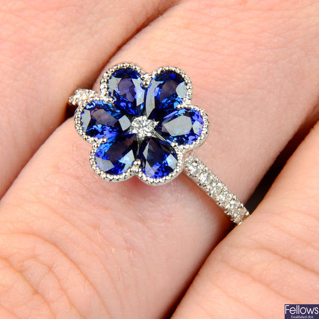 An 18ct gold sapphire and diamond floral ring.