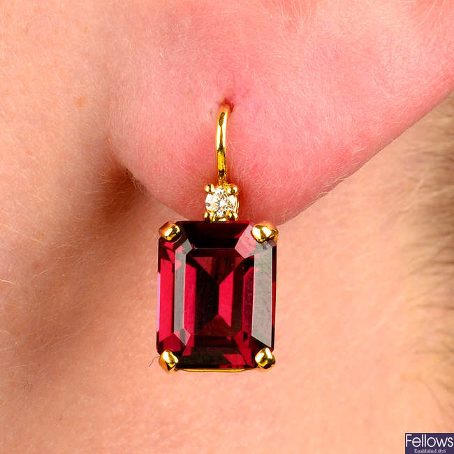 A pair of deep red garnet and brilliant-cut diamond earrings.