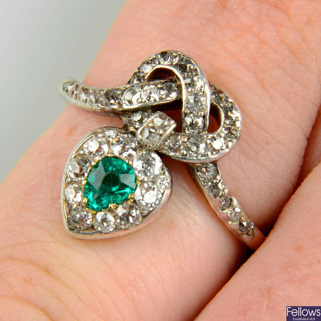 A late Victorian silver and gold, emerald and diamond knot and heart ring.